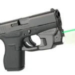 LaserMax CenterFire Light & Laser with GripSense, black handgun right-side view with green beam