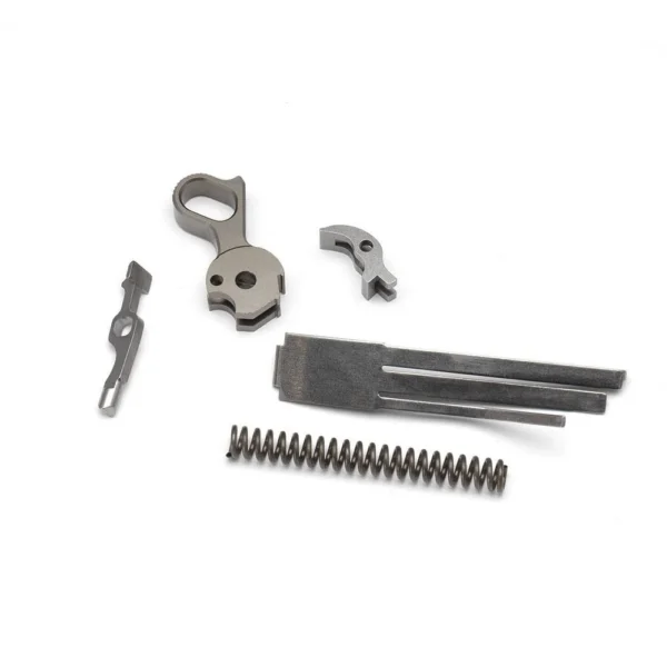 Ed Brown Trigger Pull Kit, stainless trigger parts, bars and spring arranged flat