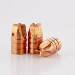 Lehigh Xtreme Defense handgun bullets, copper-coloured, with three upright and one on its side
