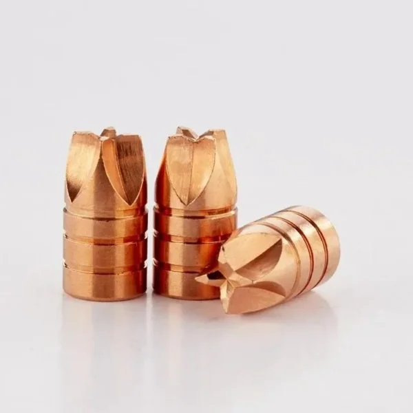 Lehigh Xtreme Defense handgun bullets, copper-coloured, with three upright and one on its side