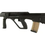 STEYR AUG A3 M2 556N 16" 30RD BLK black side view with top rail, vertical grip and tan magazine