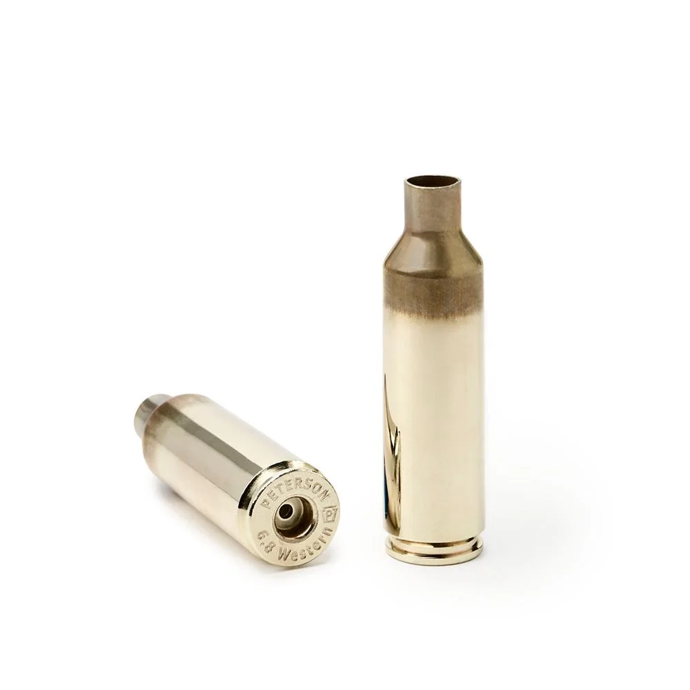 primary-42300 Peterson Unprimed Rifle Brass 6.8 Western, two gold cases, one upright and one showing case head