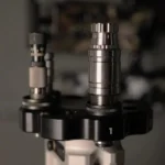 Area419 Zero M-Series Sizing Dies, two silver dies with black Zero Shell Holder mounted on press