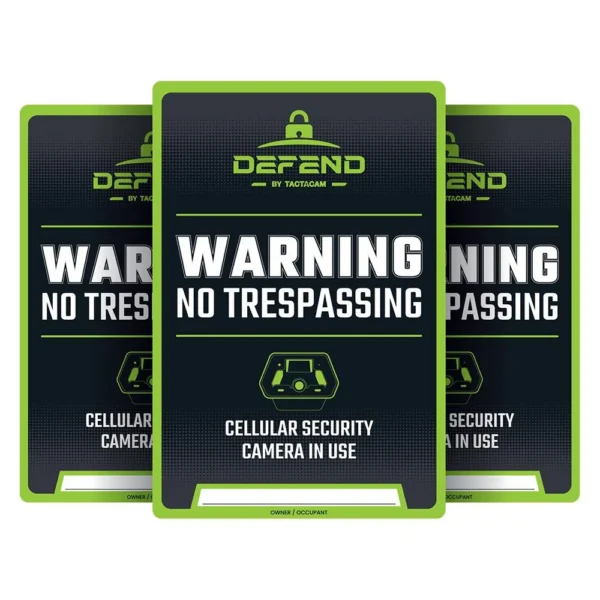 Tactacam Defend No Tresspassing Sign, front view of three black and green warning signs