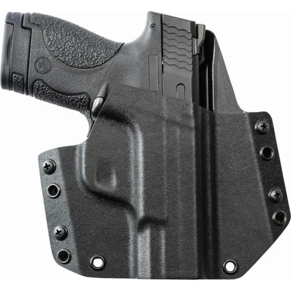 Mission First Tactical OWB Holster, black molded holster holding a handgun with mounting screws