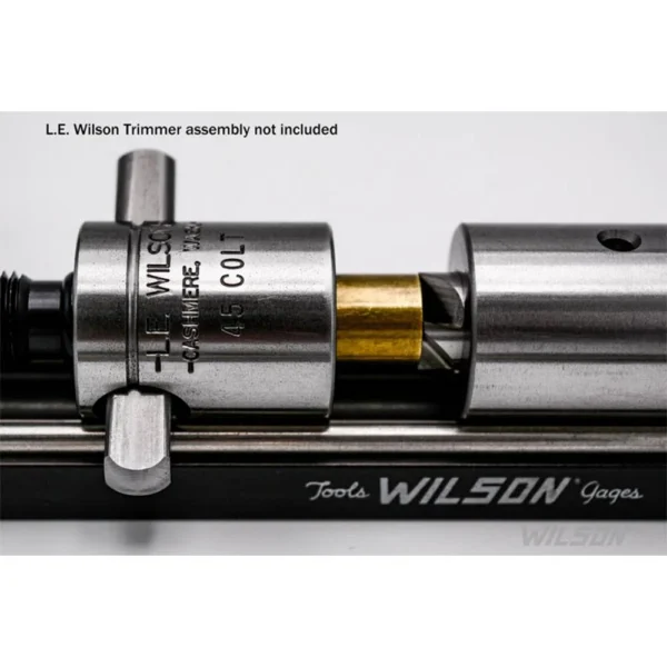Wilson Q-Type Case Holder, close-up side view of silver holder mounted with a brass case