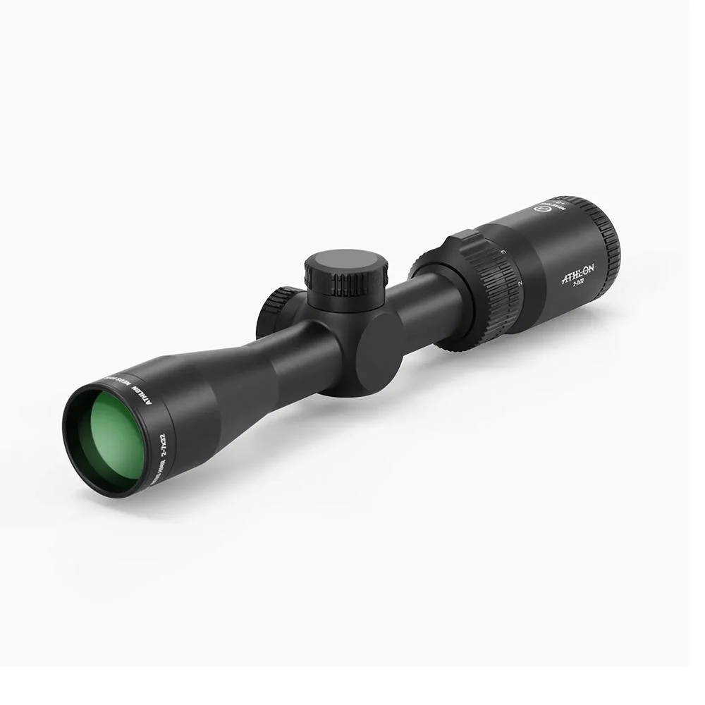 primary-43349 Athlon Neos HMR 2-7x32 black rifle scope in angled view with green-tinted objective lens