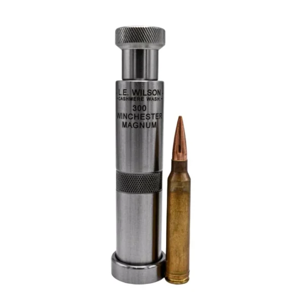 L.E. Wilson Stainless Steel Chamber Type Bullet Seater Die upright beside a cartridge