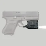 Crimson Trace Lightguard for Glock G26 G27, black unit mounted under pistol with light beam visible