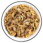 Readywise Pro Meal Beef Stroganoff bowl of noodles and sliced mushrooms in sauce, top view