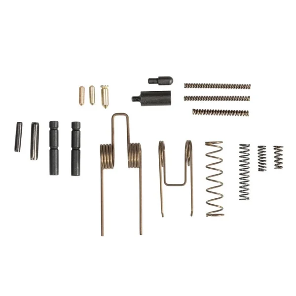 One Horse AR-15 Oh-Shyt Kit, assorted black and brass springs, detents and pins laid out