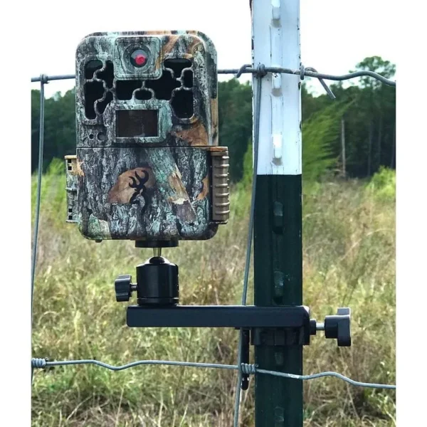 Browning Trail Camera T-Post Mount, front view holding a camouflage camera on a fence post