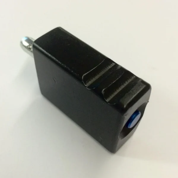 Masterpiece Arms Rotating Barricade Stop, angled black block with ridged top and silver pin