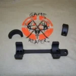 DNZ Game Reaper black one-piece scope mount, top view with two rings and loose cap