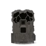 Gsm Stealth Cam QS20 grey trail camera, front view with bark texture, lens and dark sensor panel