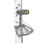 Gsm Hawk Helium Ultra Lite Hang-On Treestand, gray platform and seat mounted on tree