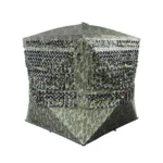 Gsm Muddy Carnage Die Cut Ground Blind, angled front view in Mossy Oak Bottomland camouflage