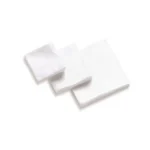 Hoppe's Gun Cleaning Patches, several square white fabric patches stacked and spread out