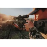 Leupold VX-5HD G2 3-15X44 Windplex scope mounted on a rifle held by a shooter outdoors