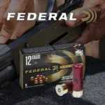 Federal Premium Personal Defense Shotshells, box with red and clear shells beside a shotgun