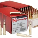 Hornady HRNDY 223REM 55GR SP red boxes with cartridges and white trays, front view