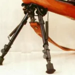 Harris Bipods Leg Notch Solid Base, front angled view mounted on a wood-stock rifle