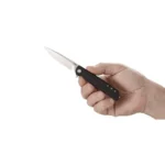 CRKT LCK+ Folding Knife black handle with silver blade open, held in hand