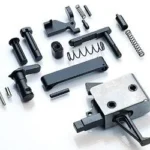 CMC AR-15 LPK with Flat Trigger, assorted black and silver parts laid out from above