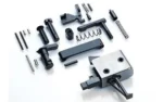 CMC AR-15 LPK with Flat Trigger, assorted black and silver parts laid out from above
