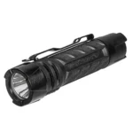 Streamlight PolyTac 1X black flashlight, angled front view with pocket clip and textured body