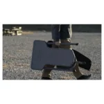 AOB Caldwell Stable Table Lite black portable shooting table shown outdoors with padded seat