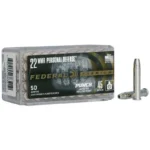 Federal FED PUNCH, clear ammunition box with two silver cartridges beside it