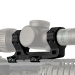 Reptilia AUS Mount, black side view mounted beneath a scope on a firearm rail