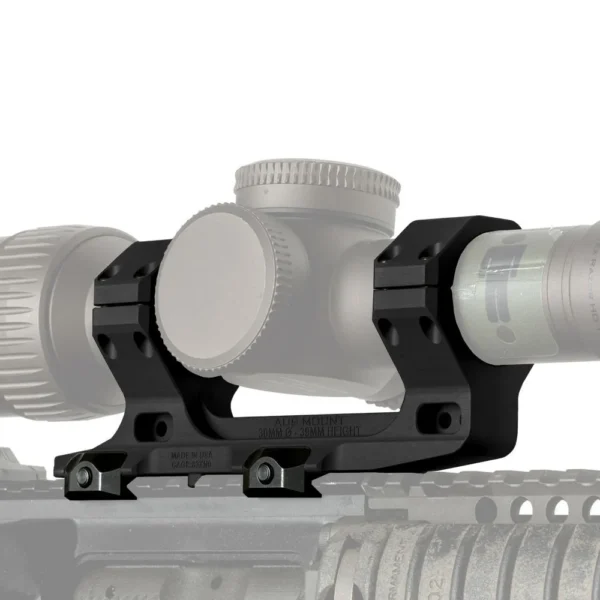 Reptilia AUS Mount, black side view mounted beneath a scope on a firearm rail