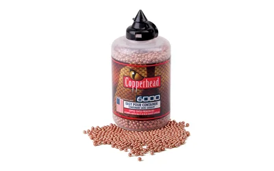 Crosman Copperhead BBs bottle with copper-colored BBs spilled beside it