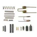Ruger RUG AR Small Parts Kit, assorted black and brass springs, pins and detents laid out