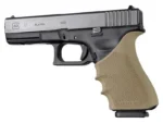 Hogue HandAll Beavertail Grip Sleeve, FDE sleeve fitted to a black pistol in left-side view