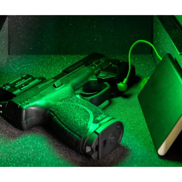 Viridian CTL Custom Tactical Weapon Light, mounted on a black handgun under green illumination