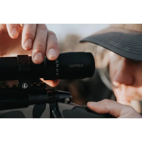 Leupold VX-5HD Gen 2 Rifle Scope black scope mounted on a rifle, shooter adjusting eyepiece