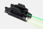 LaserMax Spartan green laser and light combo in black, angled side view with green beam visible