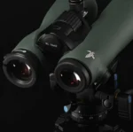 MAGVIEW B1 XL Binocular Adapter, close-up of green binoculars mounted above a tripod head