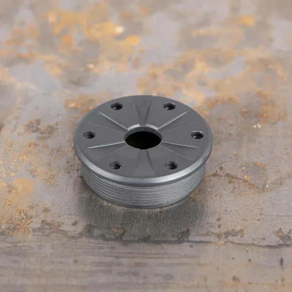 SilencerCo SCO BRAVO FRONT CAP, gray angled top view with center opening and six holes