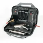 G-Outdoors Double Compact Pistol Case, open black case with handgun and magazine pockets