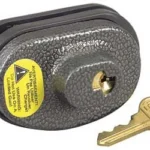 MASTERLOCK TRGR LCK KEY ALK P104 NCA, black trigger lock with brass key and yellow label
