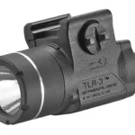 Streamlight TLR-3 black tactical light, front-left view with round lens and rail mount