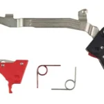 Timney Alpha Trigger Ruger RXM red and black trigger components with springs, top view