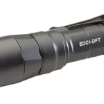 SUREFIRE EDC1 DFT 650 LUM BLK, angled side view with reflector, pocket clip and textured tailcap