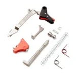TIMNEY UBK FOR GLOCK GEN 3-4 silver, black and red internal parts arranged with springs