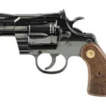 Colt's Manufacturing COLT PYTHON blued revolver, left-side view with brown checkered grip