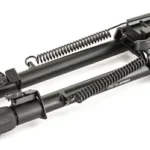 UTG TACT OP BIPOD W/QD LVR MNT 8-12, folded black bipod in angled side view with spring-loaded legs